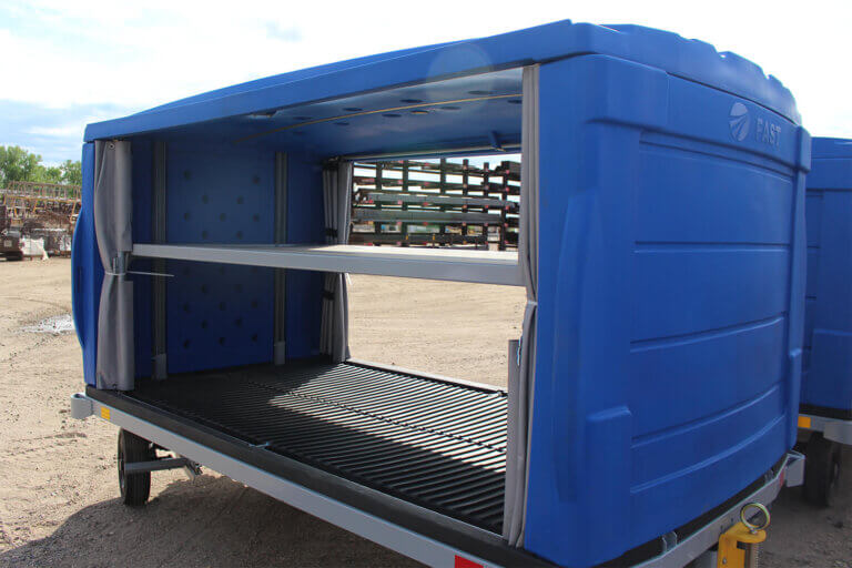 Open blue airport baggage cart showing interior compartment with v-style floor and side curtains.
