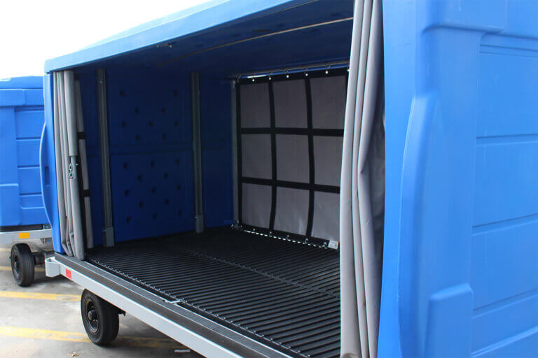 Open blue baggage cart showing interior with V-style floor and gray curtains.