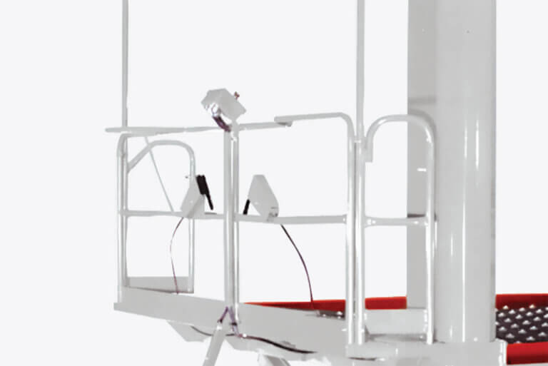 White scissor lift platform with safety railings and mounted control panel on white background.